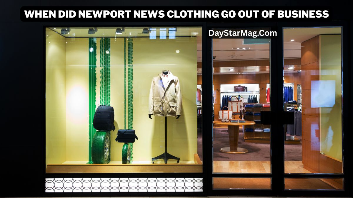 “A storefront display featuring a beige jacket on a mannequin alongside black bags and green decorative elements. The store interior is visible through glass doors, showing shelves with clothing and accessories. The image includes the text ‘When Did Newport News Clothing Go Out of Business’ and ‘DayStarMag.com’ at the top.”