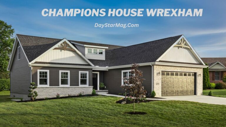 Exterior of a modern single-story home with dark siding, stone accents, and a two-car garage, set on a green lawn under a blue sky; text overlay reads “CHAMPIONS HOUSE WREXHAM” and “DayStarMag.com.”